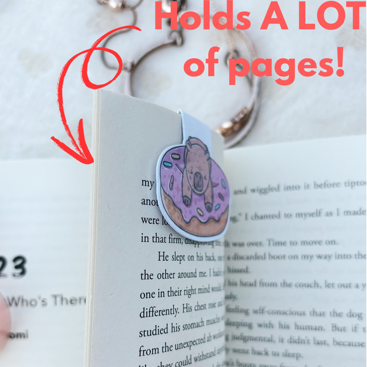Capybara laying down and reading magnetic bookmark